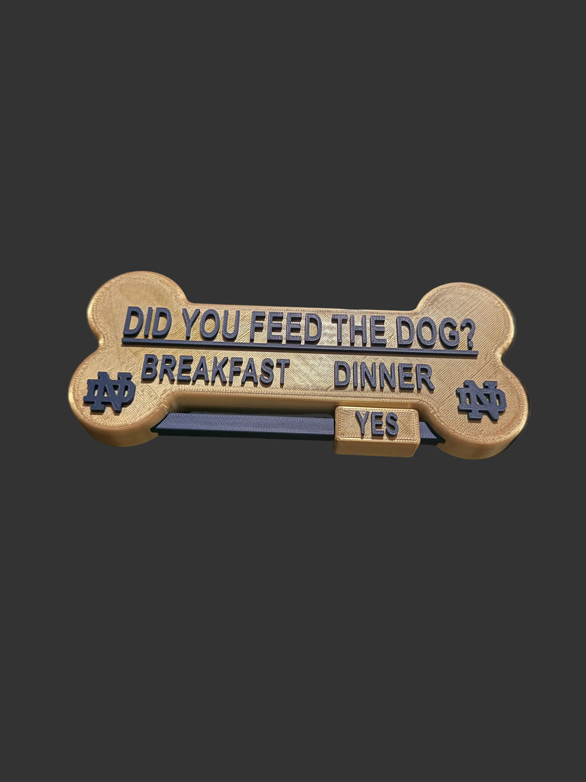 A bone-shaped print 'DID YOU FEED THE DOG? BREAKFAST DINNER' and a small 'YES' tab, Sports team edition